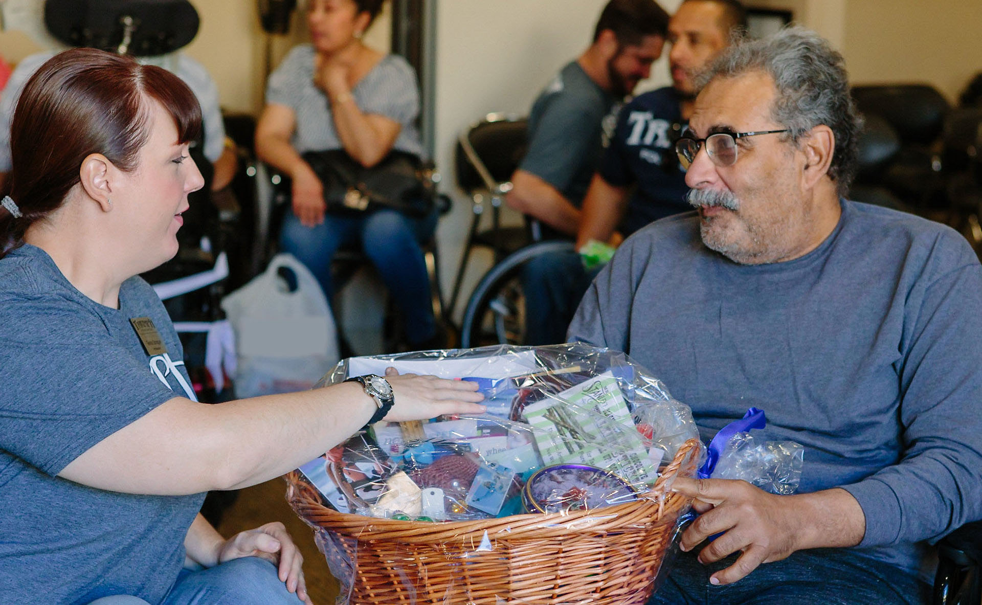 Women with red hair placing her hand on a basket on a man's lap